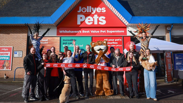 Mayor Raymond Gill is cutting the ribbon at the Whitehaven store opening.