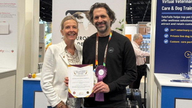 One of six: Peggy I. Pleines presents Dr. Mathias Wahrenberger with the Ladybird Excellence Award for premium innovation and sustainable design at the Global Pet Expo in Orlando.